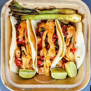 Shrimp Tacos: topped with chipotle sauce and pico de gallo. $11.95