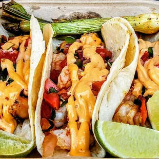 Shrimp Tacos: topped with chipotle sauce and pico de gallo. $11.95