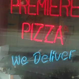 a neon sign in the window