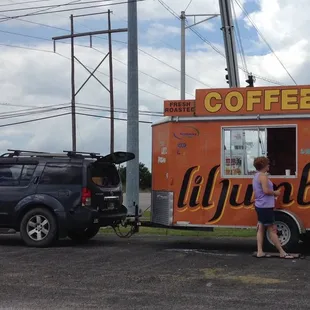 Parked near community college. Little rough around the edges, but great locally roasted coffee and made to order fresh squeezed lemonade.