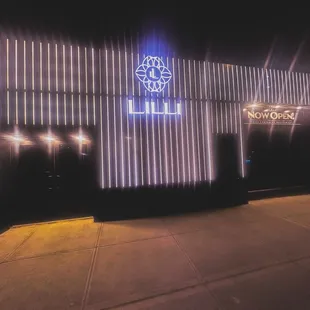 a neon sign lit up at night