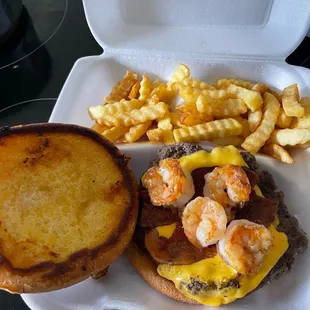 Burger with shrimp and bacon. It usually comes with veggies on it but I ordered it plain.
