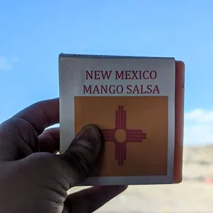 The front of Lillie&apos;s Handmade Soaps&apos; New Mexico Mango Salsa bar soap ft. New Mexico scenery &amp; cornflower sky in the background