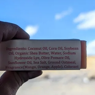 The ingredients in Lillie&apos;s Handmade Soaps&apos; New Mexico Mango Salsa bar soap ft. New Mexico scenery &amp; cornflower sky in the background