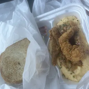 Fish and grits with toast