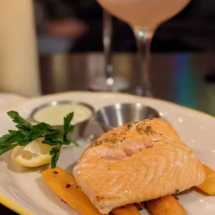 a plate of salmon and carrots