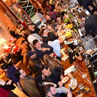 a large group of people at a bar