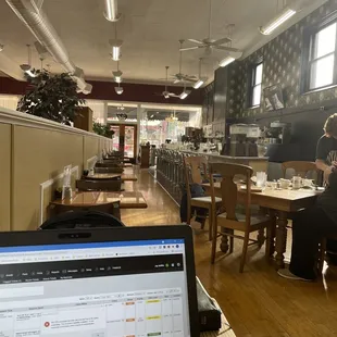 Partial view of dining area and counter seating.