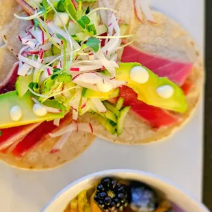 Ahi Tacos with seared ahi tuna, corn tortillas, lemon aioli, radish, cucumber, and microgreens