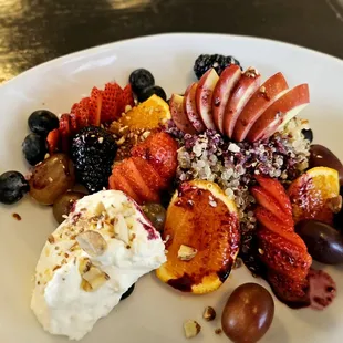 Almonds and Cream Quinoa with berry coulis, seasonal fruit, almond infused cream and almonds