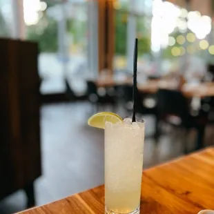 a glass of lemonade on a table