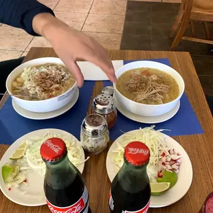 a person reaching for a bowl of soup