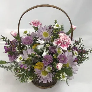 Pastel Spring Colors in shades of purples, yellow with a touch of pink using fresh flowers, greenery and filler that include pixie carnati