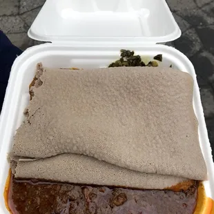 a meal in a styrofoam container