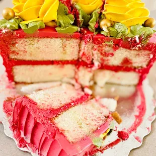 a red velvet cake with a slice taken out of it