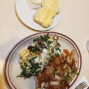 My order of egg whites only omelette with onions, spinach, mushrooms. Side potatoes on the side