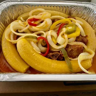 Turkeys stew with onions bell pepper and plantains