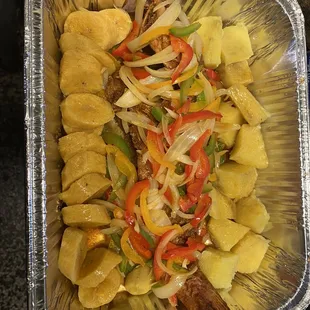 Fried fish with cut plantains and steamed vegetables