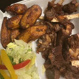 Fried goat sweet plantains and lettuce salad