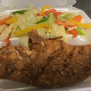 Fried fish with stems vegetables