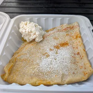 Lily's lemon crepe with fresh whipped cream and powdered sugar