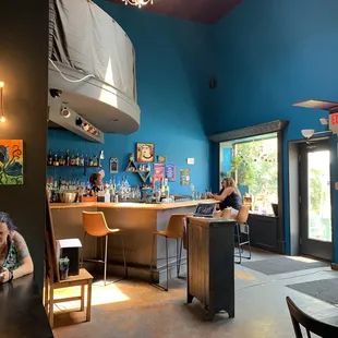 a woman sitting at a bar