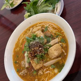 bún riêu - rice vermicelli with ground pork, fried tofu, sliced tomatoes