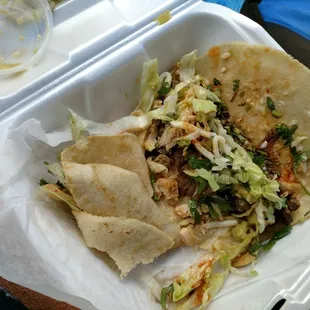 a taco in a styrofoam container