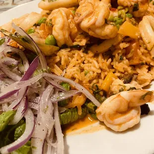 a plate of food with shrimp and rice