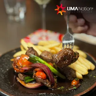 a plate of food and a glass of wine