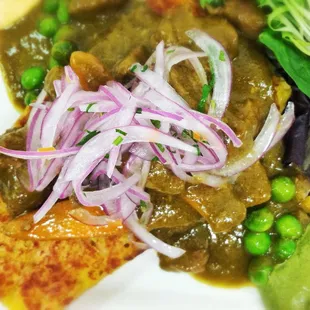 Our Seco: Different kind of meats cooked in a cilantro and red wine stew.