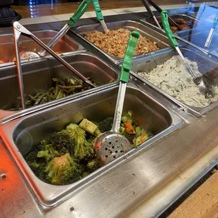 a variety of food in a buffet