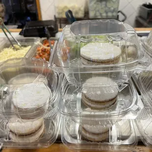 a variety of sandwiches in plastic containers