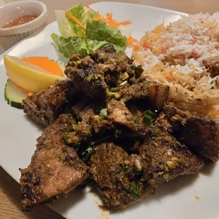 Pork Sekwa (Nepali BBQ) with flavored rice