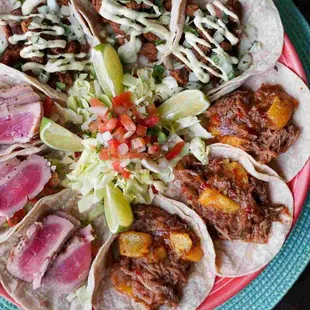 a plate of tacos with meat and vegetables