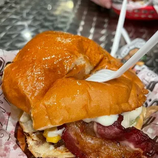 a sandwich with bacon and cheese