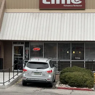 a car parked in front of the restaurant