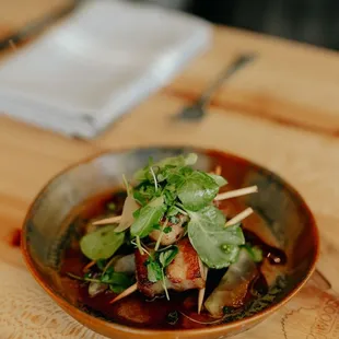 a plate of food on a wooden table