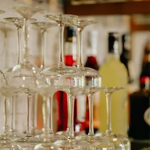 wine glasses stacked on a glass shelf