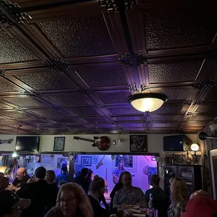 a group of people sitting at a bar