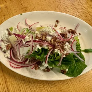 The Butter Leaf Wedge, version with blue cheese dressing and pecans ($13 as of 08/2024)