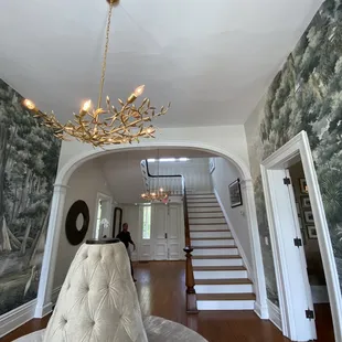 a view of a living room and staircase