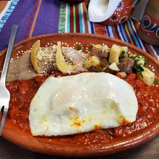 Asado with over easy eggs