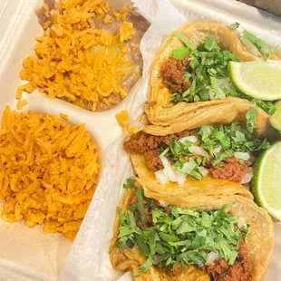 Chorizo tacos with rice and refried beans