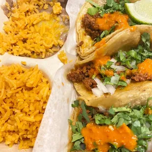 Chorizo tacos with rice and refried beans