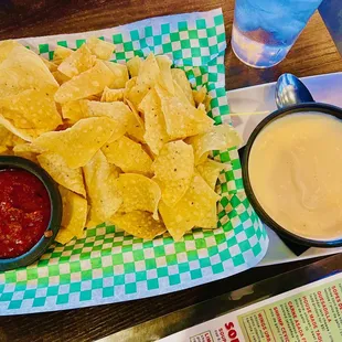 complimentary chips and salsa with added on white poblano dip