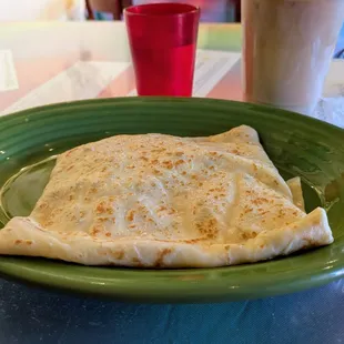Lox and cream cheese crepe with capers and tomatoes.