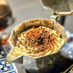 TIRAMISU espresso-soaked lady fingers layered with mascarpone cream, dusted with cocoa powder