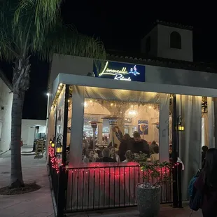 Outside of the restaurant and patio with heat lamps.