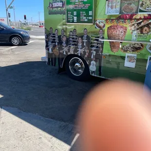 a man standing in front of a food truck